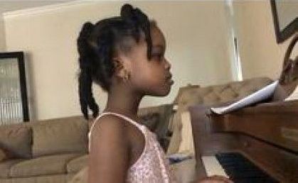 Kid playing piano