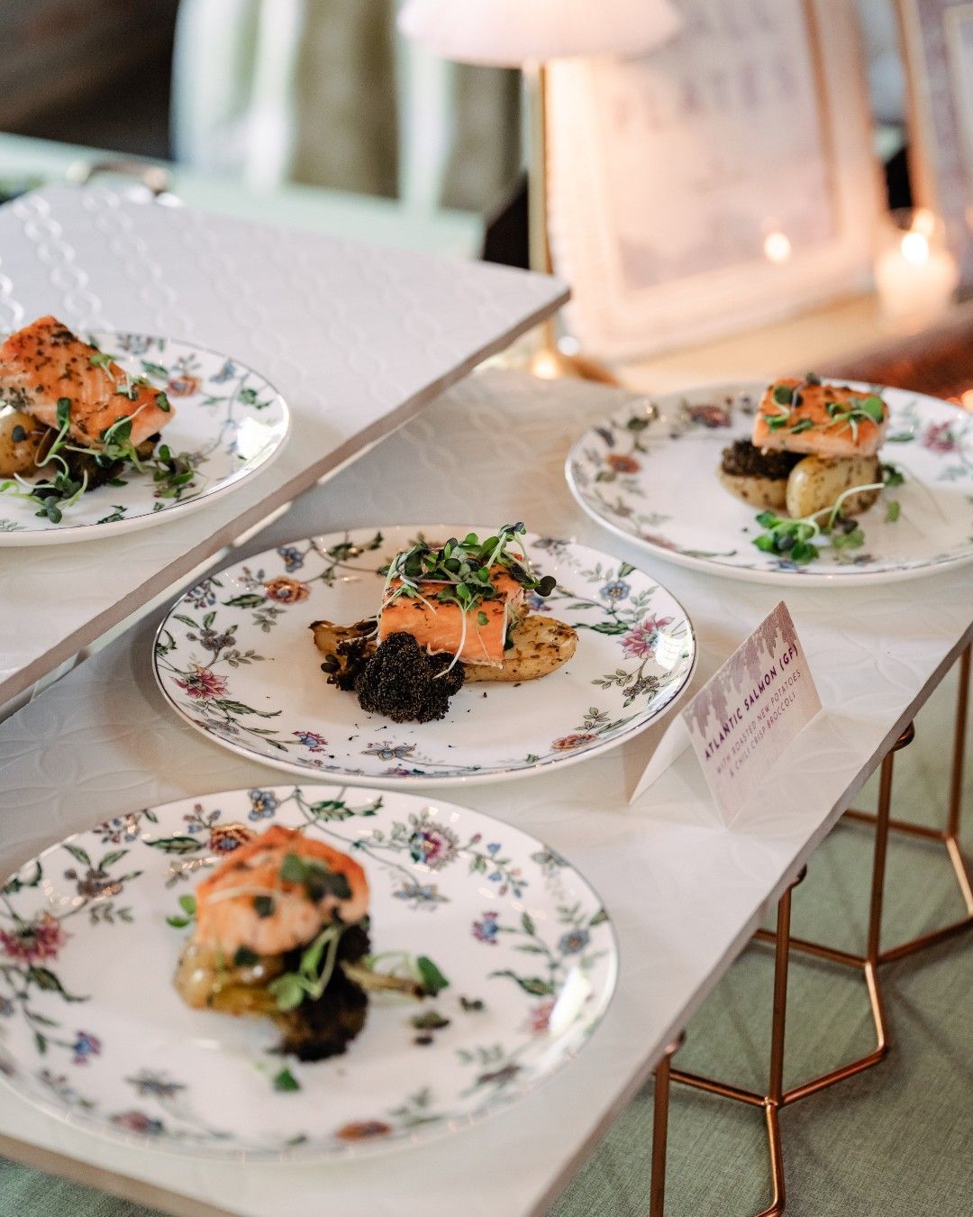 Elegant plated appetizers on a decorative dessert table at an event