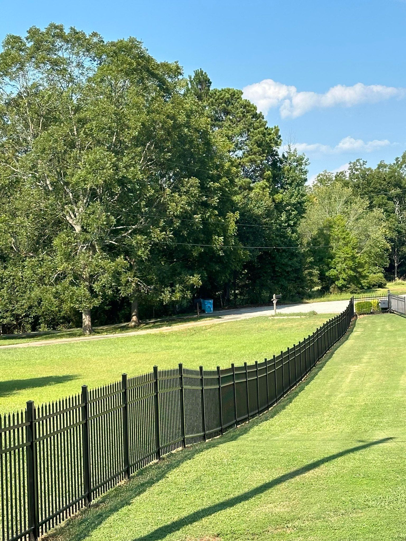 completed aluminum fence installation for a residential property 