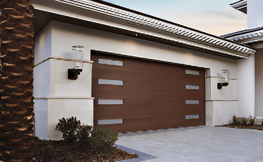Modern house exterior with a brown garage door and stone accents