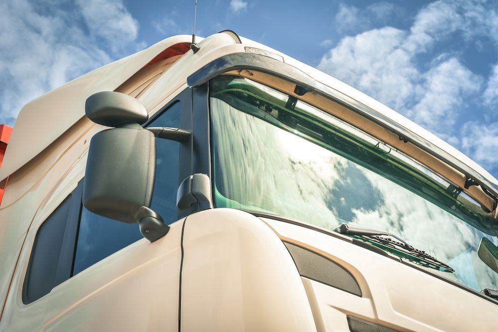 A Close Up of a Truck's Windshield With a Blue Sky in the Background — Crakka Windscreens in Harrington, NSW