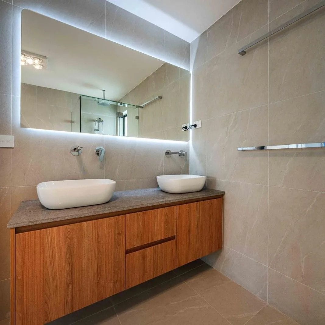 A Bathroom With Two Sinks And A Large Mirror — ASM Joinery In Fyshwick, ACT