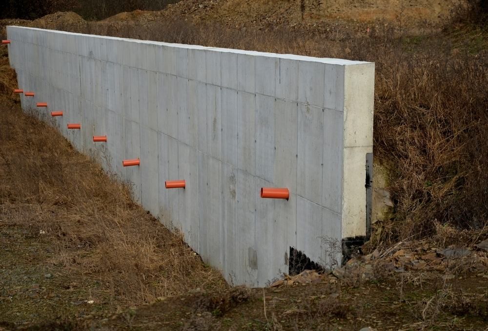 A Large Concrete Wall is Being Built in the Middle of a Field — Ape Earthmoving In Warwick, QLD
