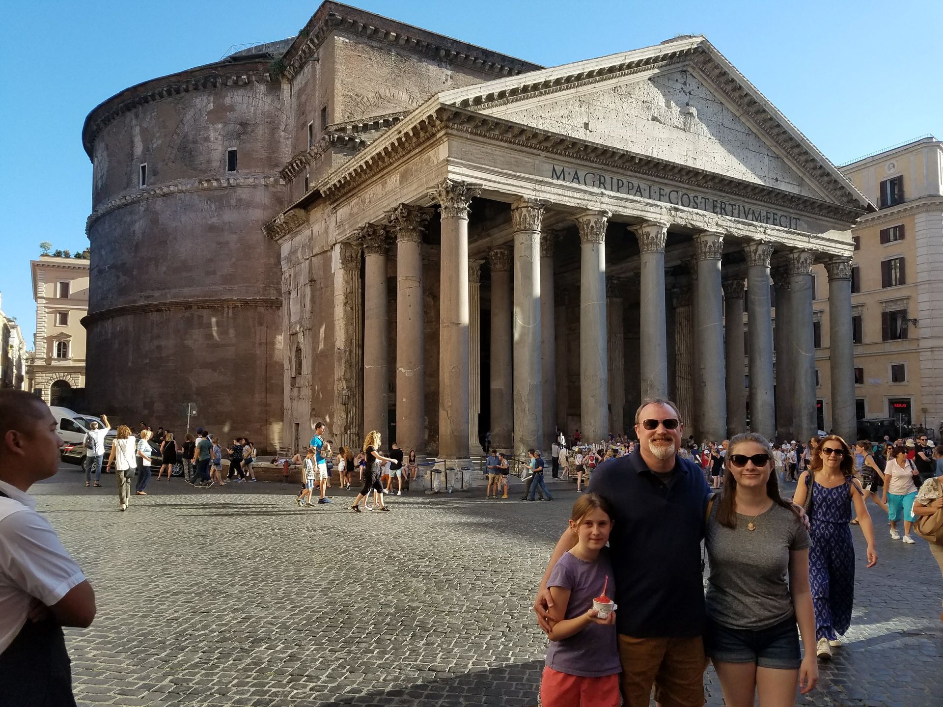 Family in front of the Rome Pantheon with cobblestone streets