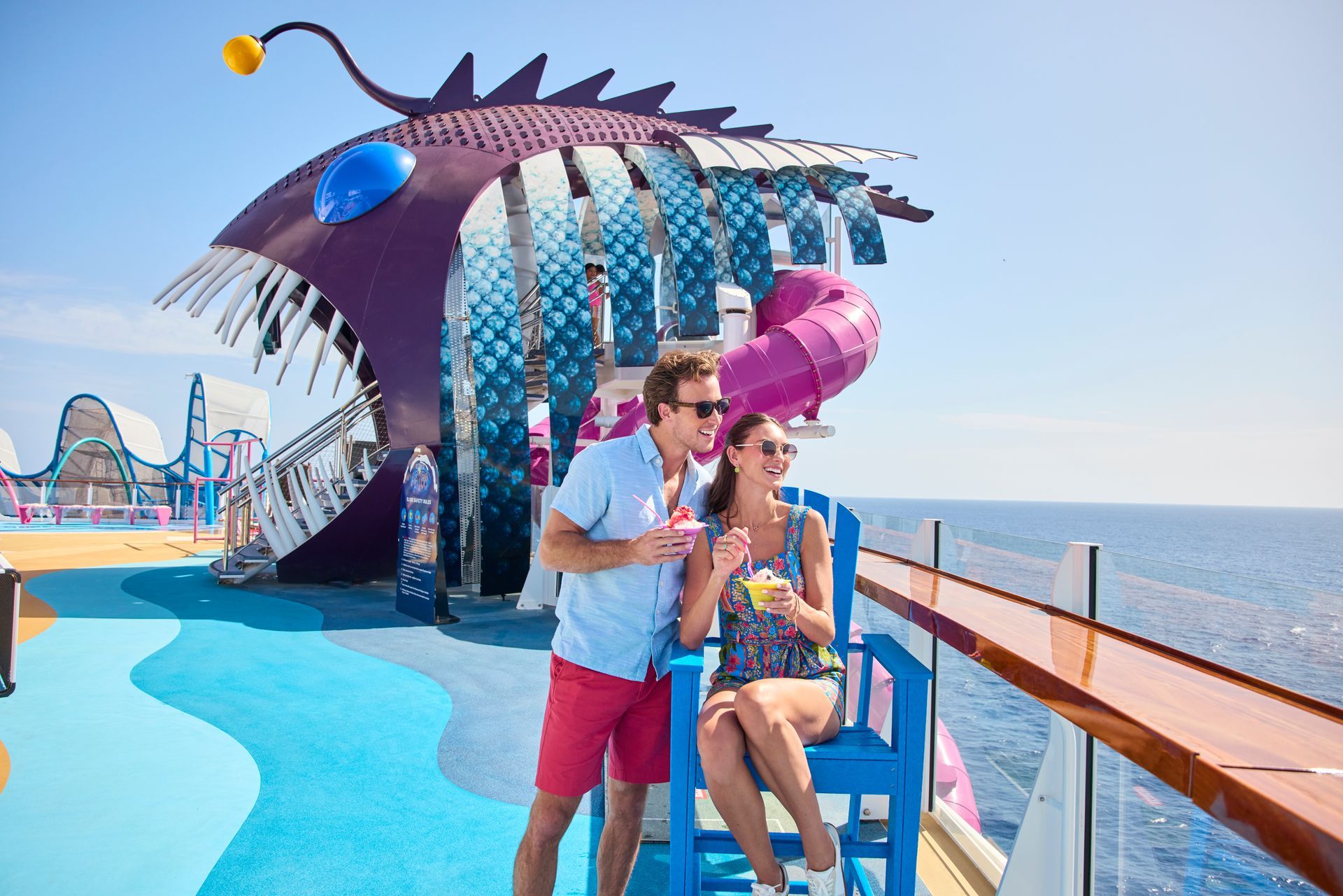 A couple enjoying the view from the Utopia of the Seas deck