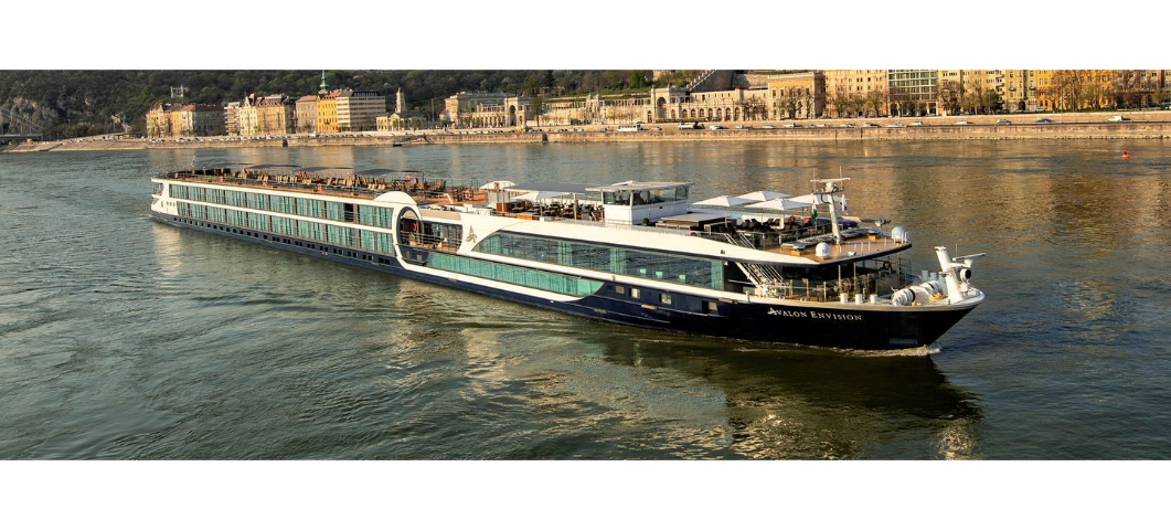 View of Avalon River Boat along the Rhine River with Village in the background 