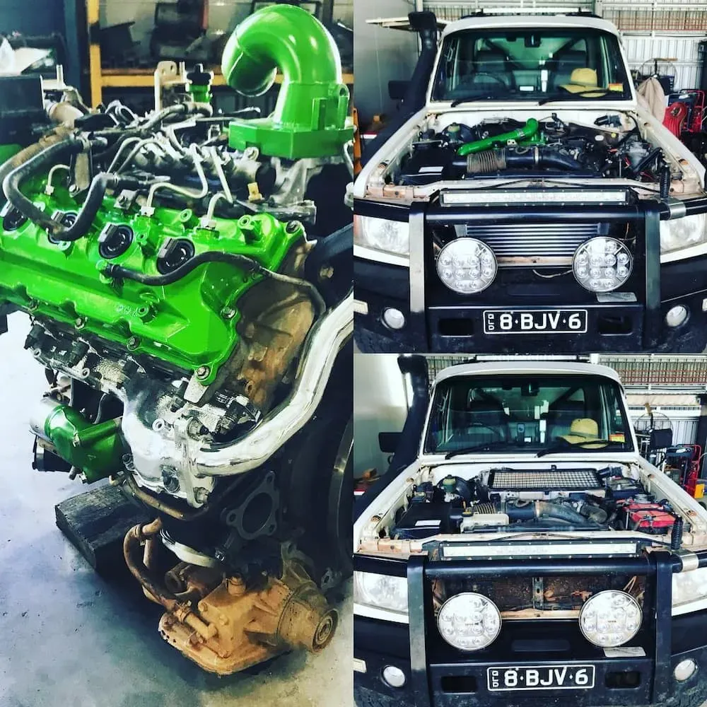 A Green Engine Is Being Removed From A White Truck — Brad's Auto Electrical in Mareeba, QLD