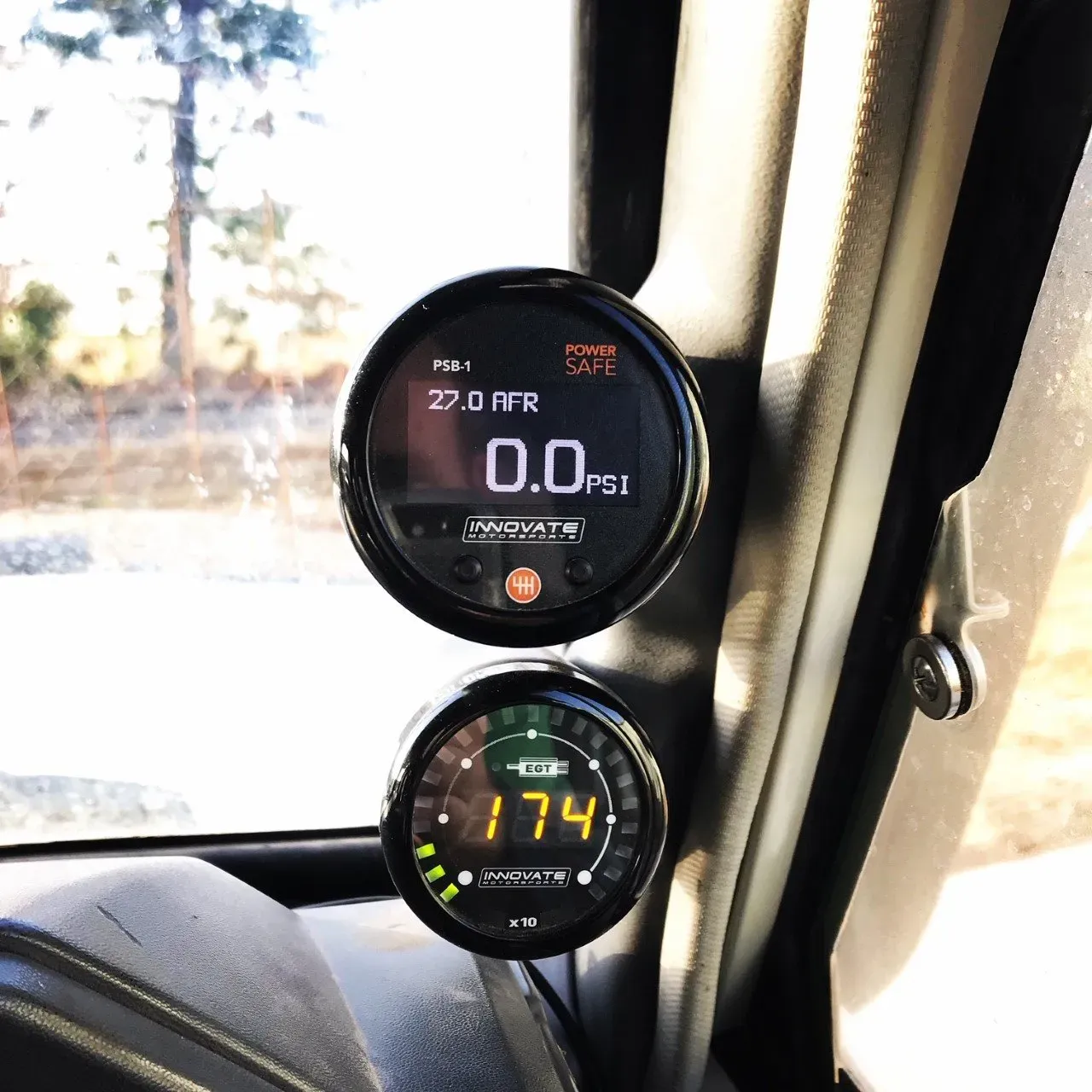 Two Gauges On The Side Of A Car One Of Which Reads 174 — Brad's Auto Electrical in Mareeba, QLD