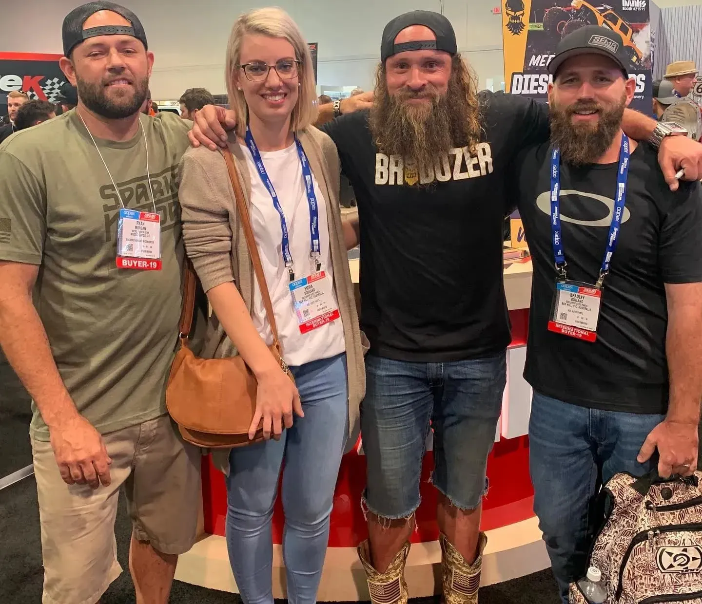 A Man In A Hard Hat Stands In Front Of A Large Truck — Brad's Auto Electrical in Mareeba, QLD