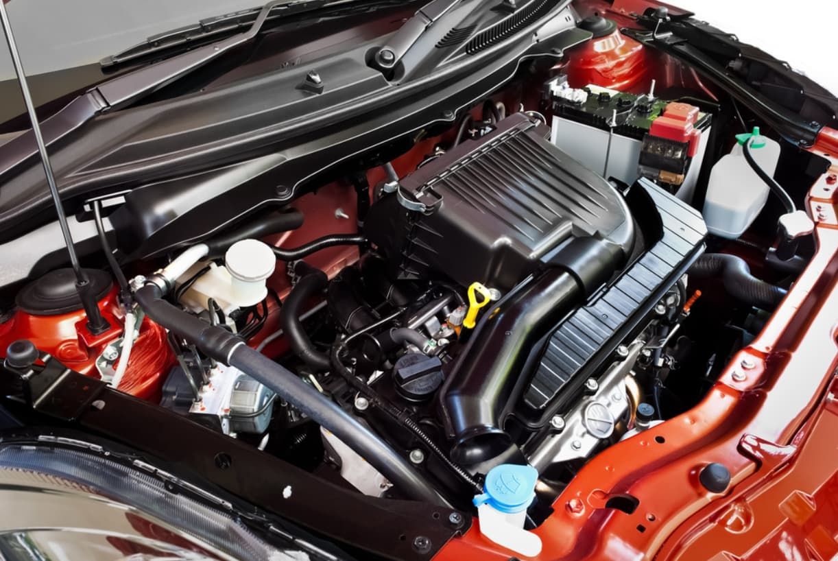 The Engine Of A Red Car Is Shown With The Hood Open — Brad's Auto Electrical in Mareeba, QLD