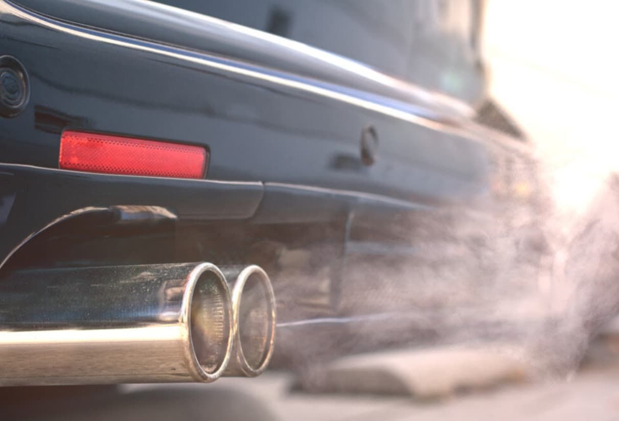 Smoke Is Coming Out Of The Exhaust Pipe Of A Car — Brad's Auto Electrical in Mareeba, QLD