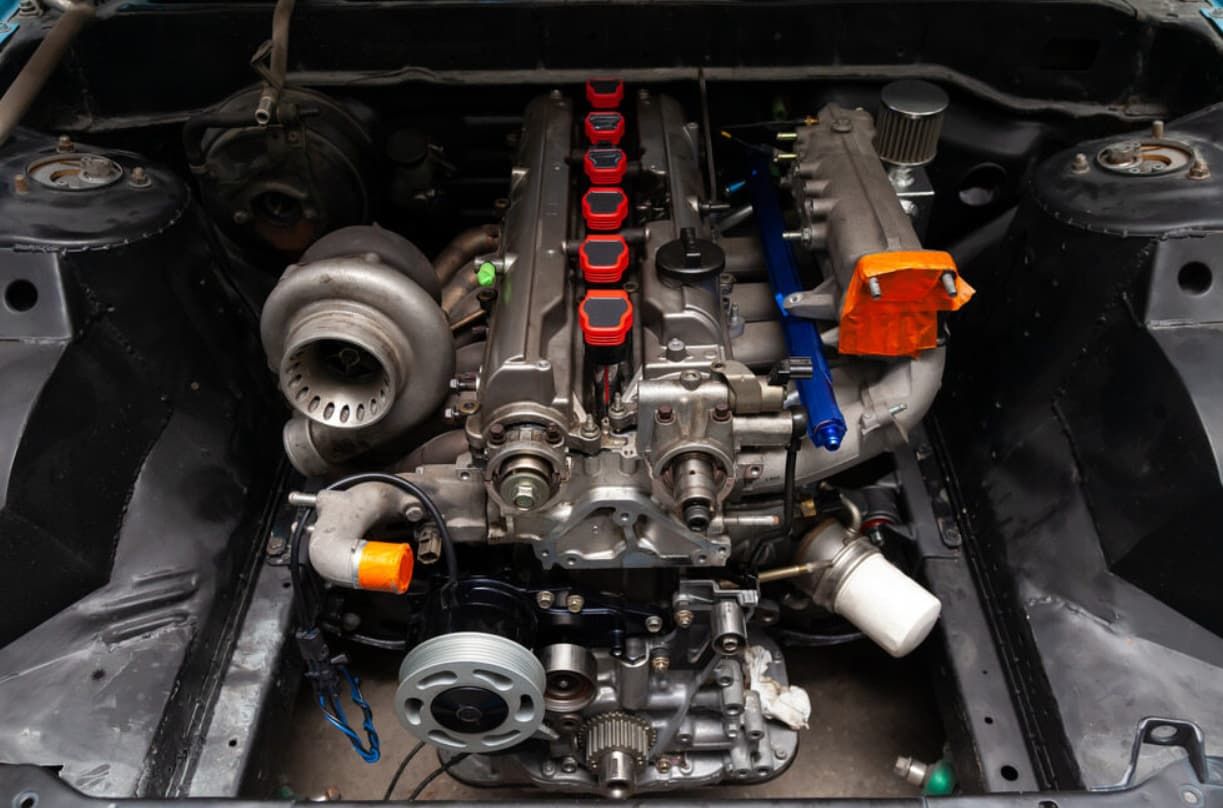 A Close Up Of A Car Engine With A Turbo — Brad's Auto Electrical in Mareeba, QLD