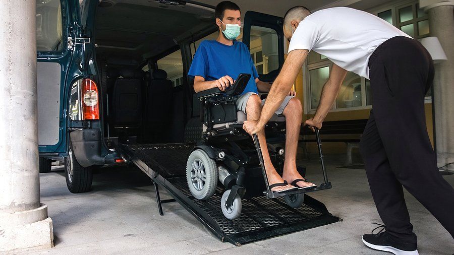 man pushing the man inside the van
