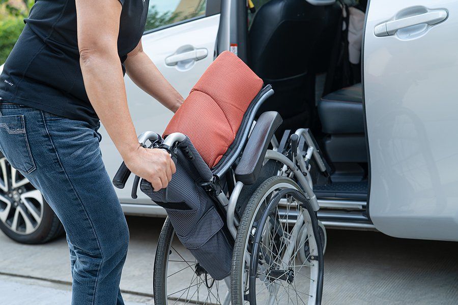 man carrying the wheelchair