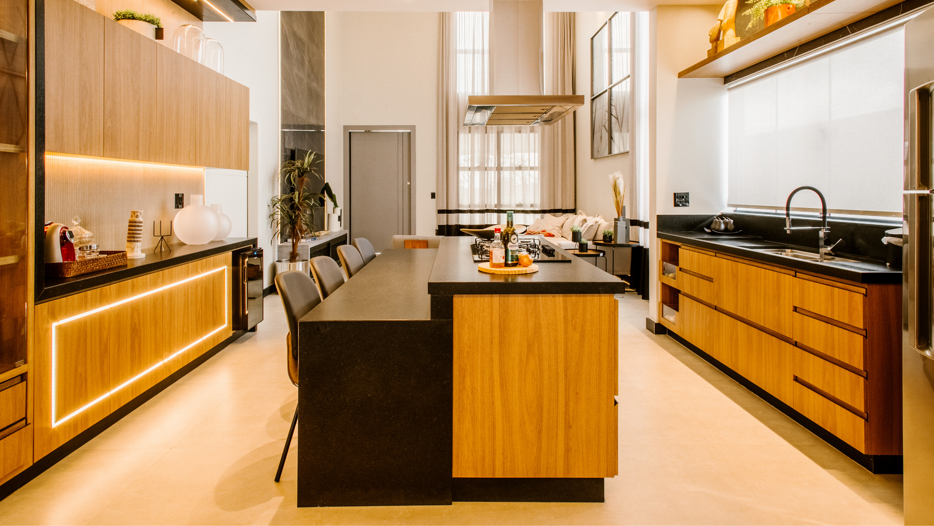 A kitchen with wooden cabinets and a large island in the middle.