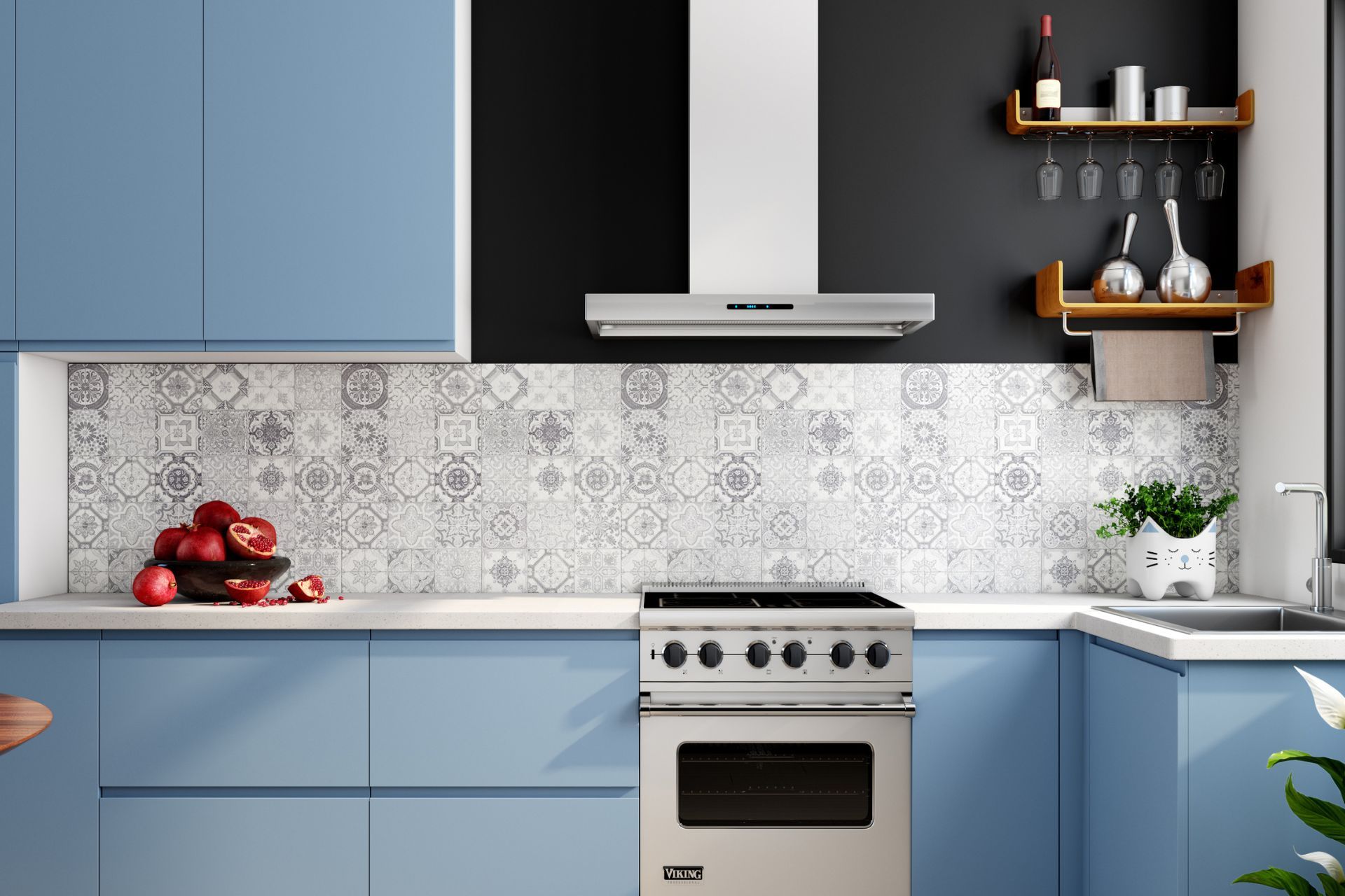 A kitchen with blue cabinets , a stove , a sink and a hood.