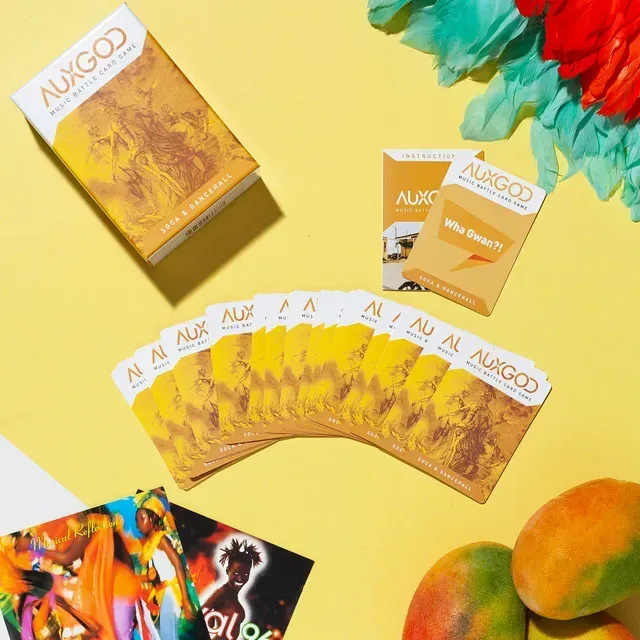 A bunch of auxgod cards are on a table