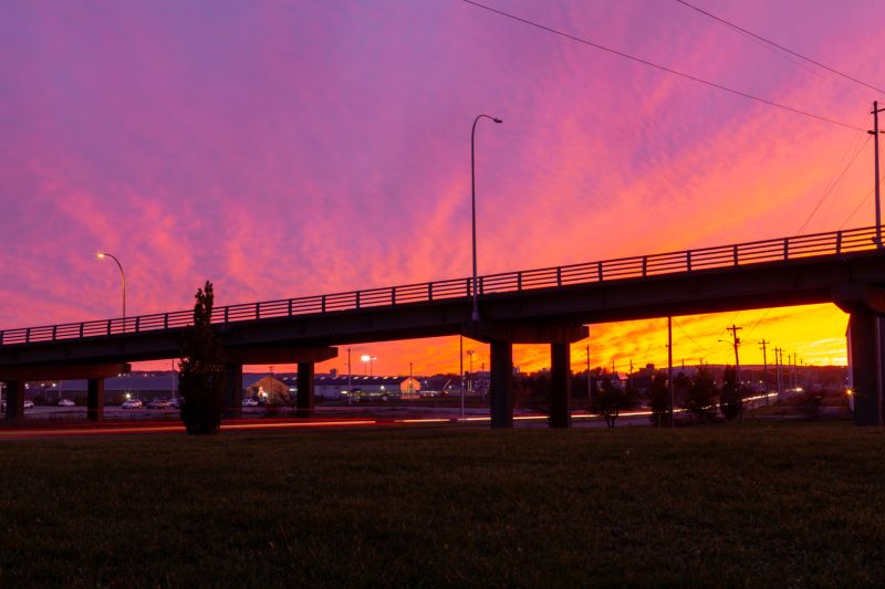 A bridge with a sunset in the background