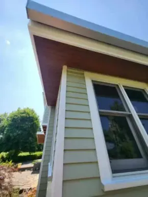 Freshly stained exterior wood soffit and trim on residential home