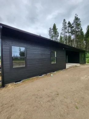 New construction home with completed black exterior paint finish
