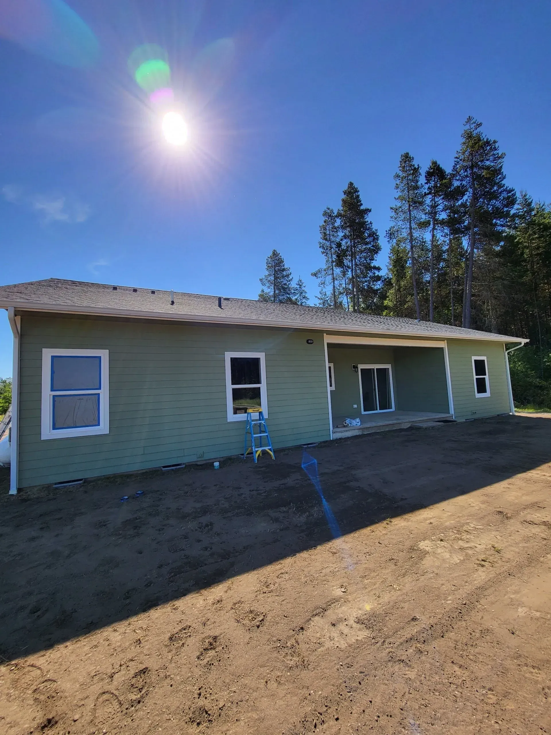 Home exterior before siding and trim painting