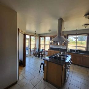 Professionally painted kitchen with neutral walls and ceiling finish