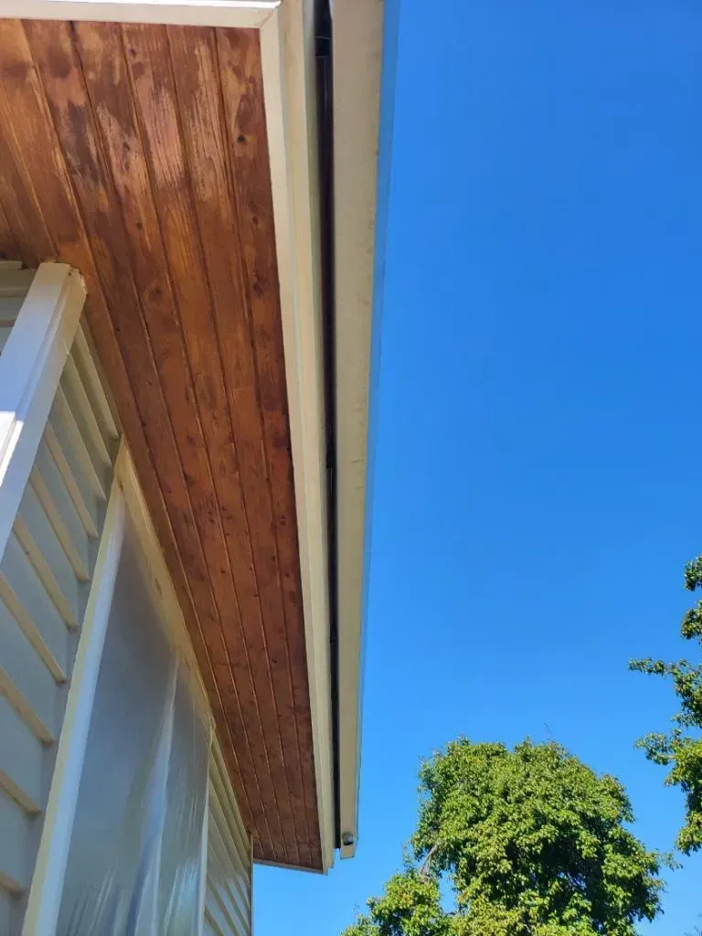 Freshly stained wood soffit and exterior ceiling with protective finish