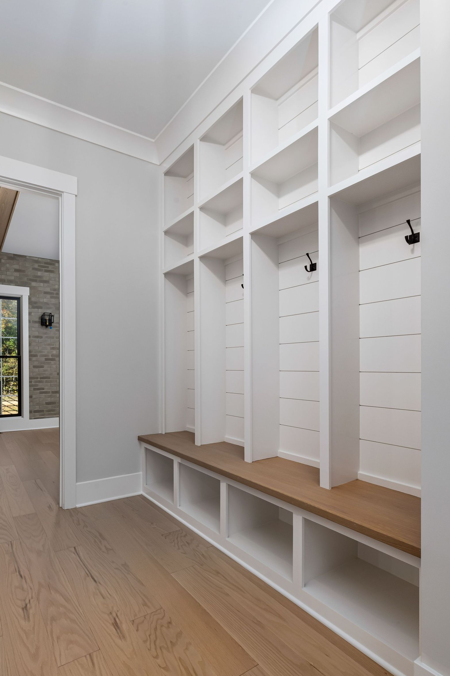 Professionally painted built-in mudroom storage and custom millwork
