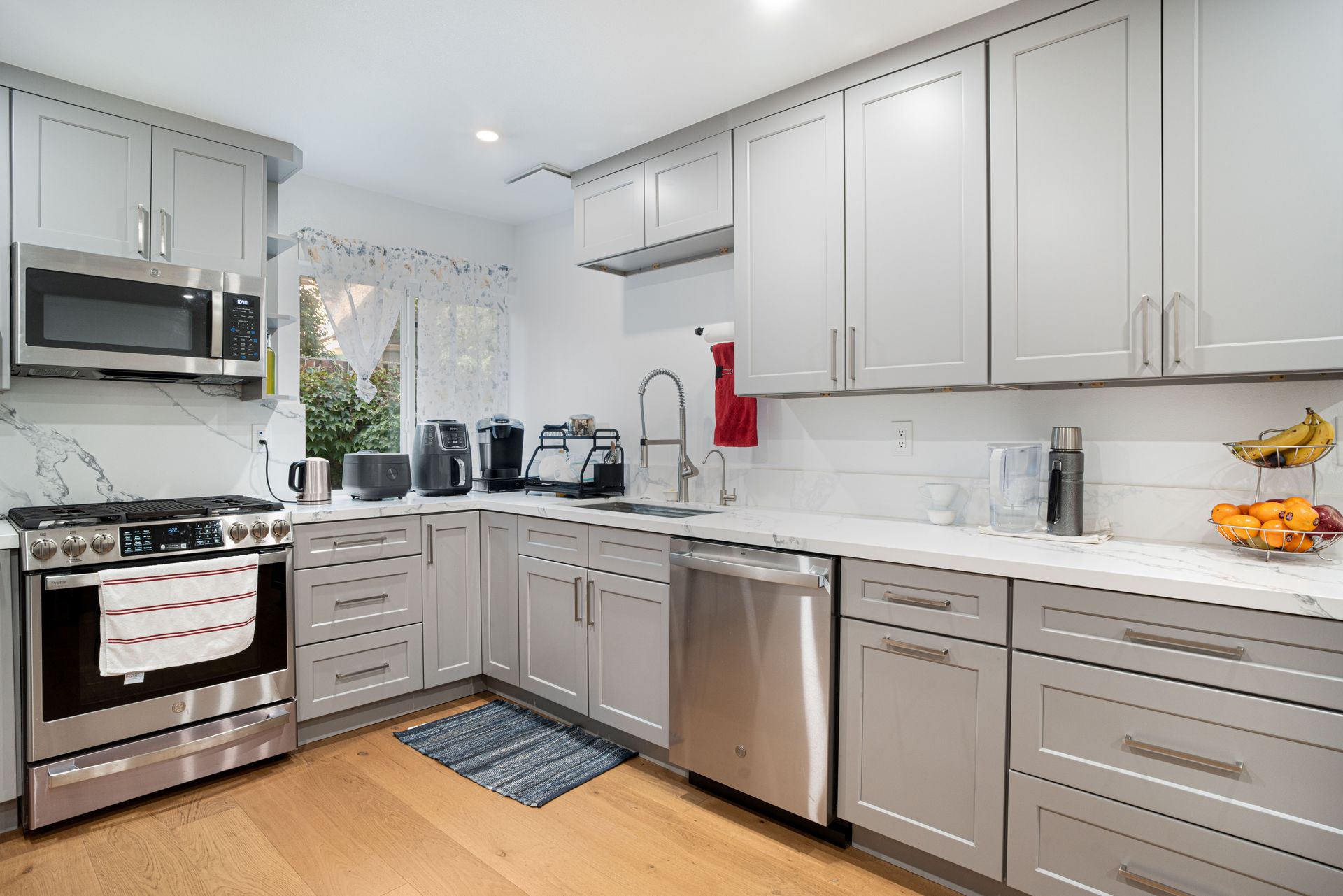 Professionally painted kitchen cabinets with a smooth painted finish