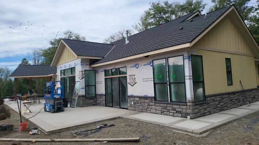 New construction home before exterior painting is completed