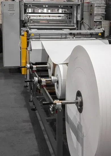 A pleater machine in a manufacturing facility. 