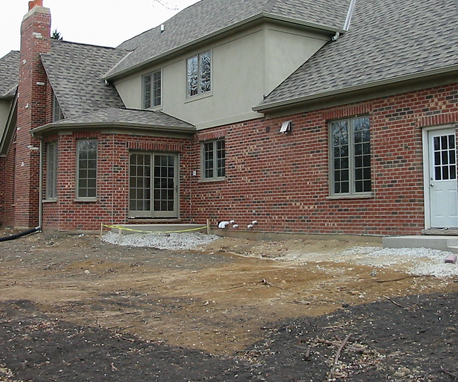 a large brick house with a white door and windows