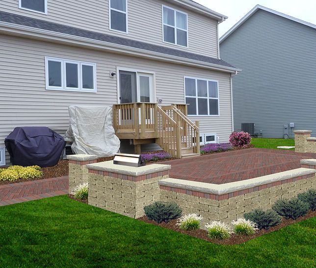 the backyard of a house with a deck and stairs