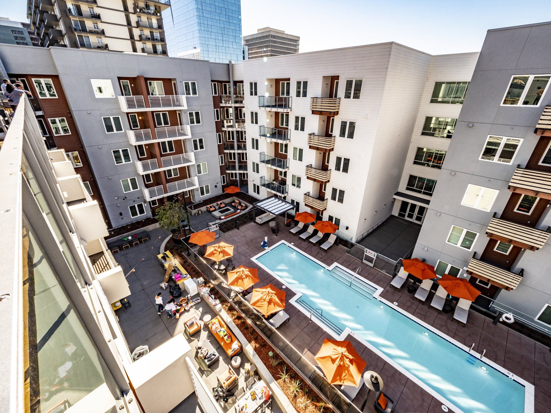An aerial view of a building with a large swimming pool at Capitol Towers.