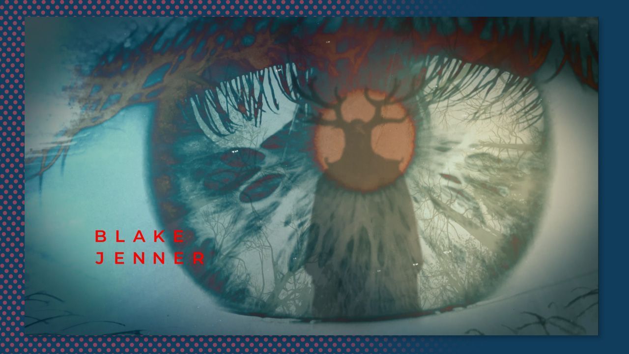 Close-up of a blue-green eye with black eyelashes and red “BLACK JENNER” text on the left.