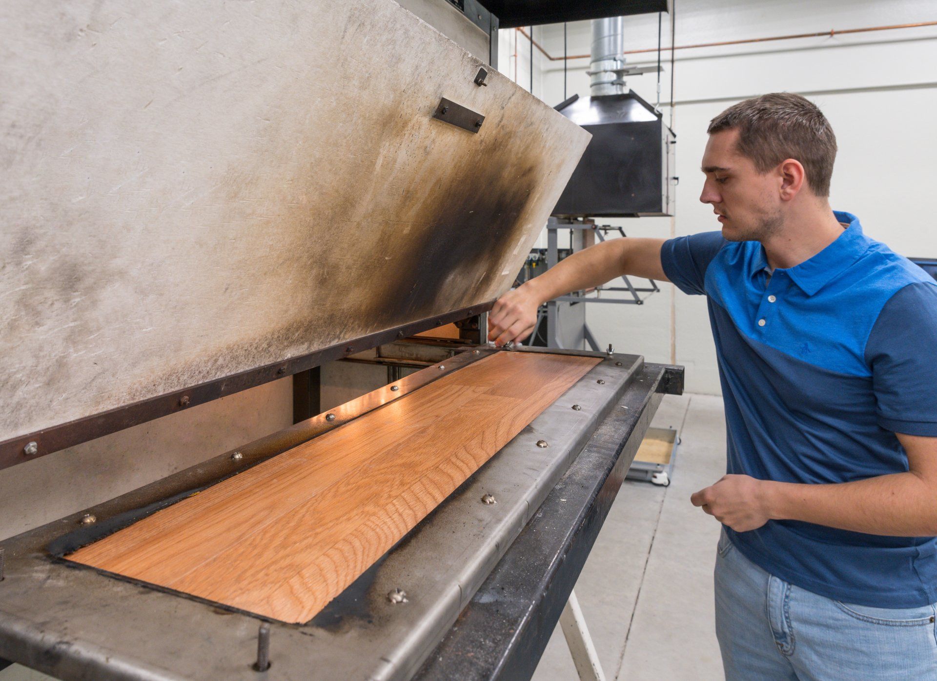 ASTM E648 Sample Being Loaded Into Test Chamber