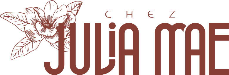 Logo for Chez Julia Mae, featuring floral illustration and text in brown.