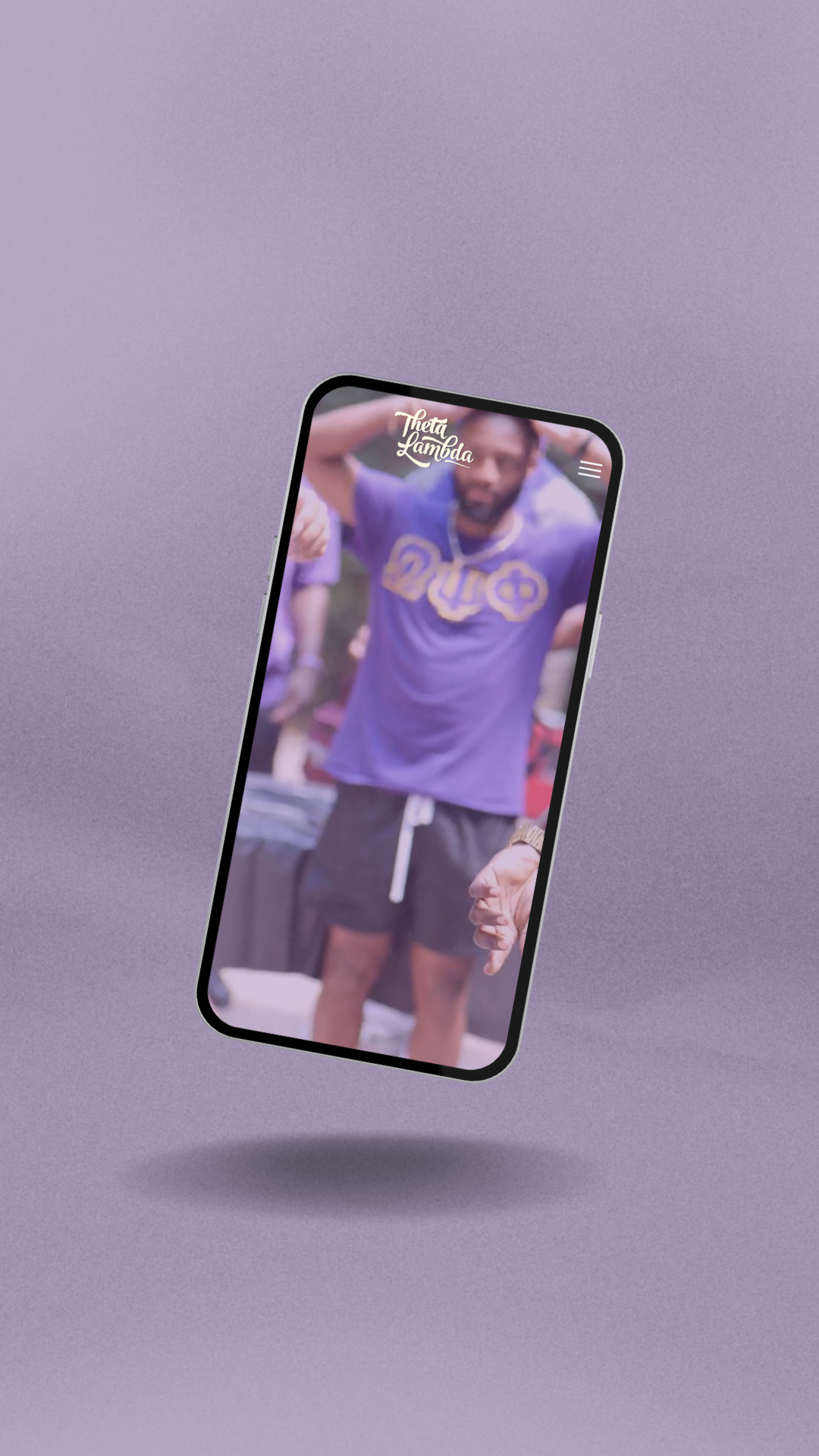 Man wearing purple shirt and black shorts on phone screen.