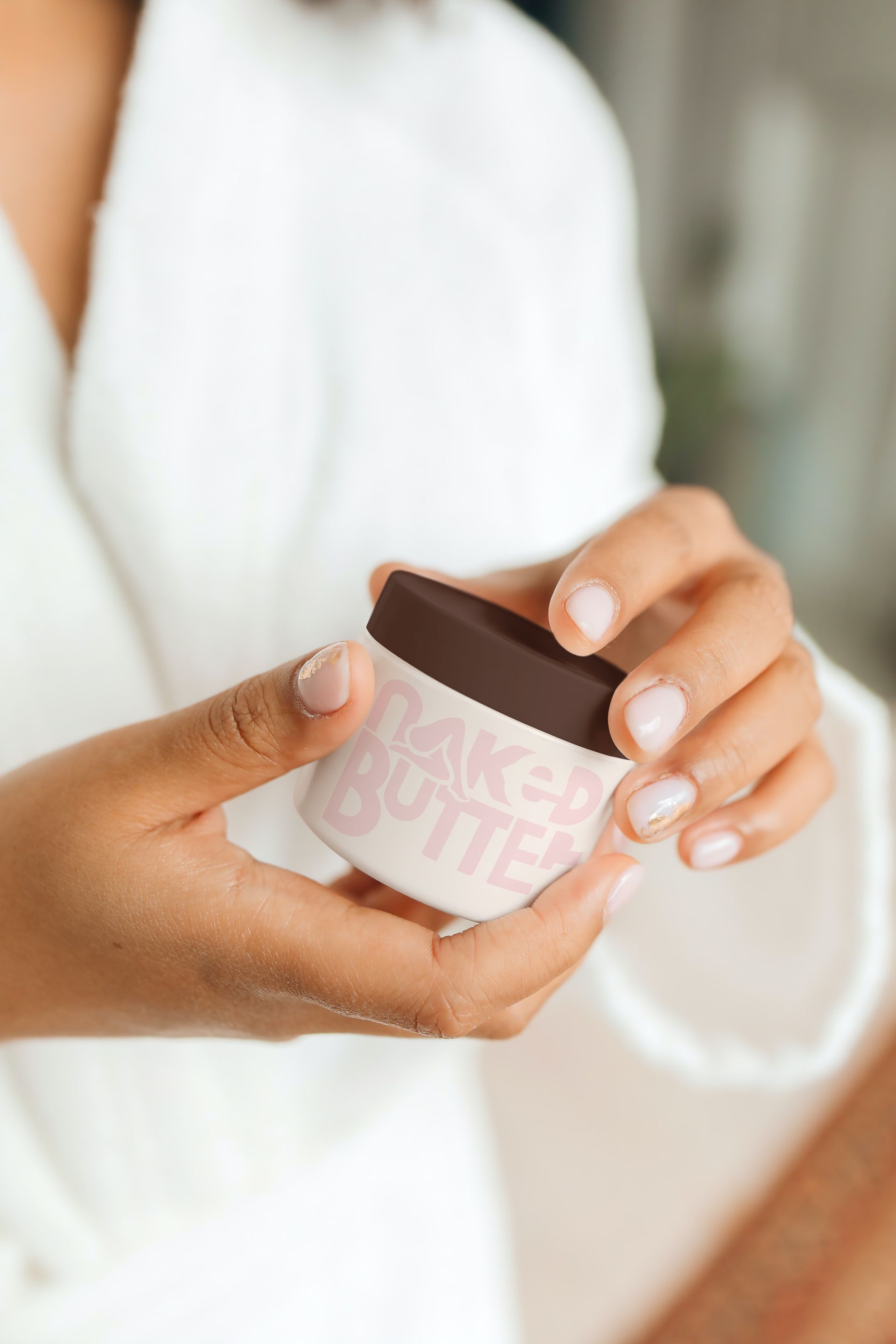 Person holding a jar of