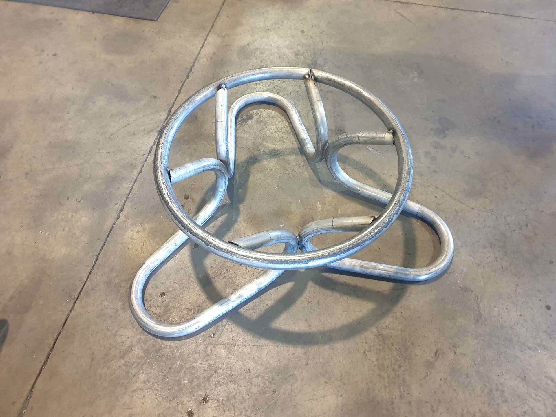 A Metal Object is Sitting on a Concrete Floor — Roll Press NT In Tivendale, NT
