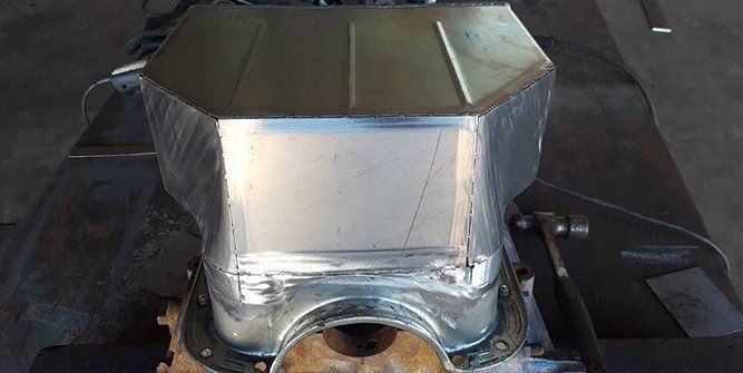 A Metal Object is Sitting on Top of a Metal Table — Roll Press NT In Tivendale, NT
