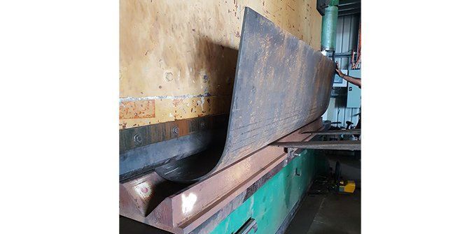 A Large Piece of Metal is Sitting on Top of a Machine — Roll Press NT In Tivendale, NT