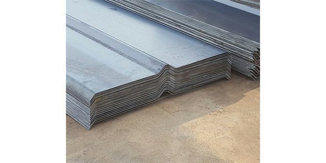 A Stack of Metal Sheets Sitting on Top of Each Other on a Cement Floor — Roll Press NT In Tivendale, NT