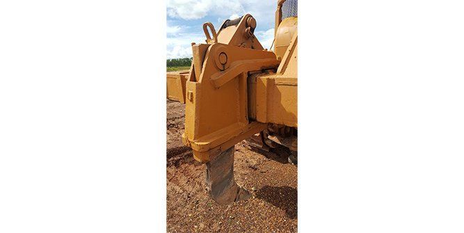 A Piece of Metal is Sitting on Top of a Table in a Garage — Roll Press NT In Tivendale, NT