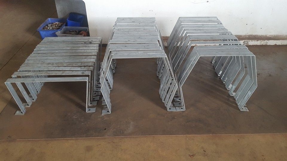 A Bunch of Metal Pieces Are Stacked on Top of Each Other on a Table — Roll Press NT In Katherine, NT