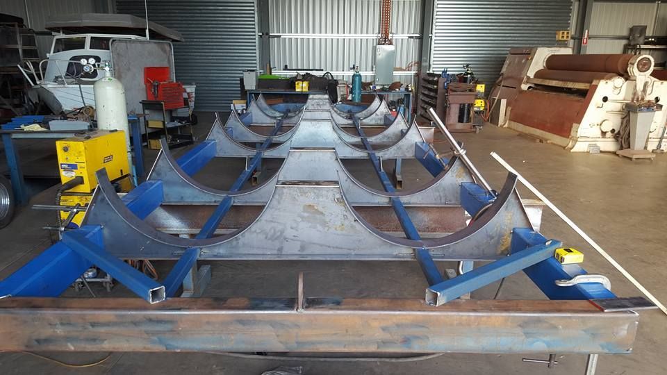 A Large Piece of Metal is Sitting on Top of a Table in a Warehouse — Roll Press NT In Katherine, NT