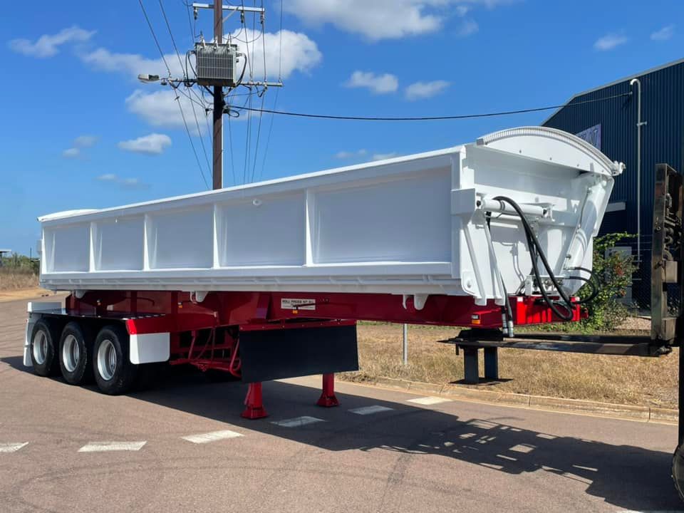 A Red and White Dump Trailer is Parked on the Side of the Road — Roll Press NT In Tivendale, NT