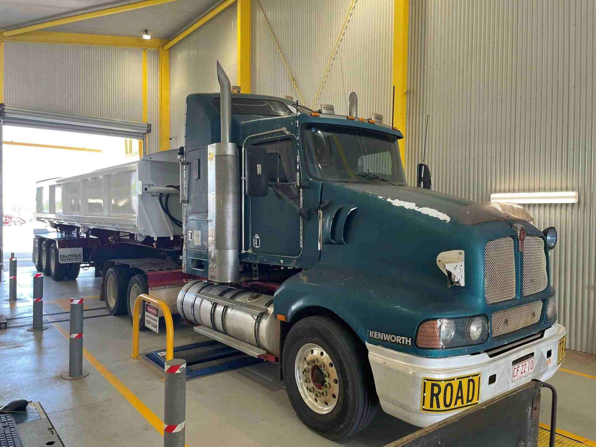 A Large Semi Truck is Parked in a Garage — Roll Press NT In Kununurra, WA
