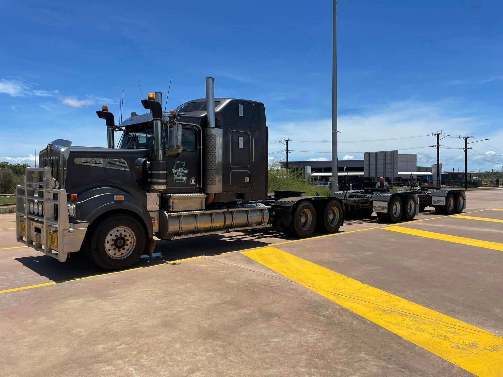 A Trailer is Sitting on the Ground Next to a Forklift — Roll Press NT In Tivendale, NT               