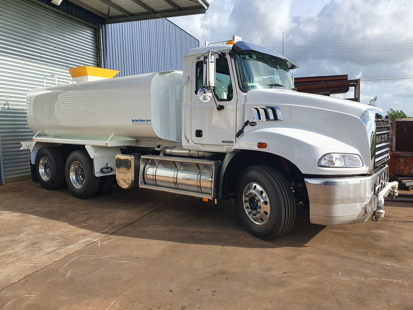 A White Truck is Parked in Front of a Building — Roll Press NT In Tivendale, NT